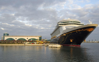 Cruise ship docked water building - magical realism free wallpaper