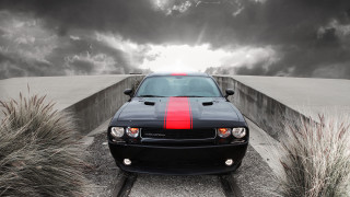 Black car red stripe track - a sunbeam in the background free wallpaper