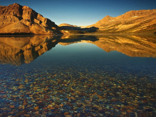 Mountain range reflection still lake 2 - a clear sky above free wallpaper