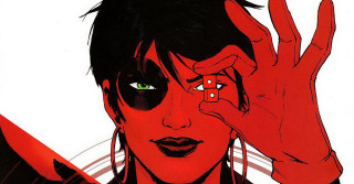 Woman green eyes black hair - a red background behind her free wallpaper