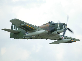 Military plane flying cloudy sky 2 - the front of the plane free wallpaper