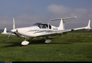 Small white plane green field - a lush green field of grass free wallpaper