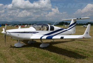 Small airplane grass field trees - top of a grass free wallpaper