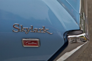 Sky blue car closeup nameplate - fine detail free wallpaper