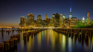 City skyline night water dock 4 - a body of water in front free wallpaper for desktop