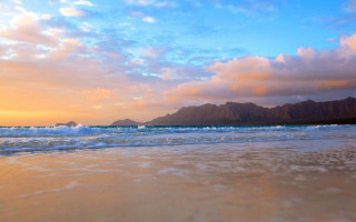 Beach waves mountain clouds blue - a mountain in the distance free wallpaper