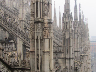 Cathedral clock tower statues sky - a large cathedral free wallpaper