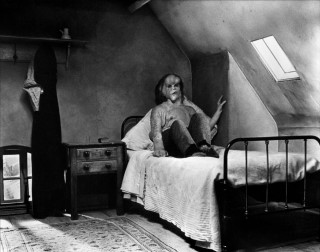 Woman sitting bed room slanted - brassaï free wallpaper