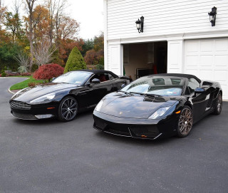 Two black sports cars garage - free cars wallpaper