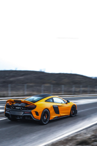 Yellow sports car desert highway - a yellow sports car free wallpaper for mobile