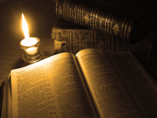 Candle lit book table candle - free light wallpaper for desktop