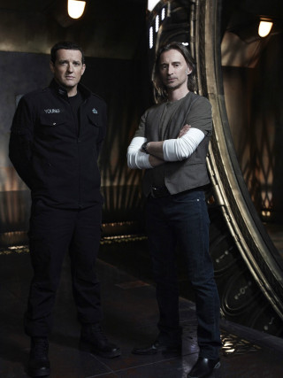 Two men standing room mirror 2 - a light fixture free wallpaper