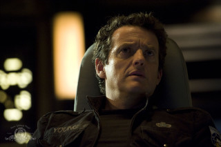 Man sitting serious look chair - his face and shoulder free wallpaper