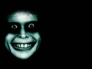 Creepy man smile dark background - a creepy smile free wallpaper
