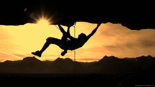 Man hanging rope climbing mountain - sunset time free wallpaper for desktop