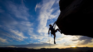 Man climbing cliff rope sky - extreme free wallpaper