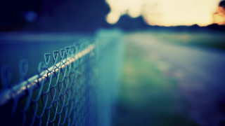 Chain link fence person walking - the distance in the distance free wallpaper