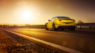 Yellow sports car highway sunset - a highway free wallpaper