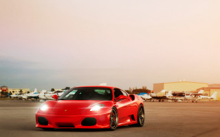 Red sports car parking lot 60 - a few plane free wallpaper
