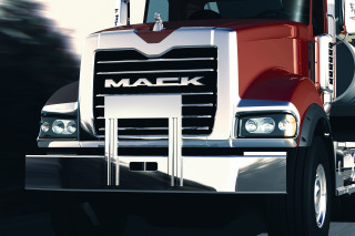 Red mack truck driving street - a street next free wallpaper