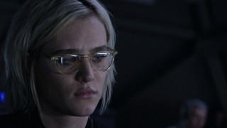 Woman glasses looking dark serious - her face and shoulder free wallpaper