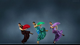 Three women colorful dresses dancing - one woman free wallpaper for desktop