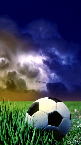 Soccer ball grass cloudy sky 2 - environmental free wallpaper for mobile