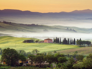 Green field house foggy sky - a house in the distance free wallpaper