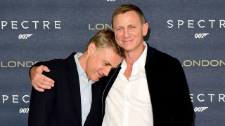 Two men hugging movie event - a wall behind them free wallpaper