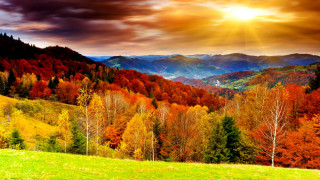 Mountain sunbeam autumn fire charizard - a scenic view of a mountain range free wallpaper
