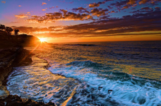 Sunset ocean waves crashing swimmer - the edge free wallpaper