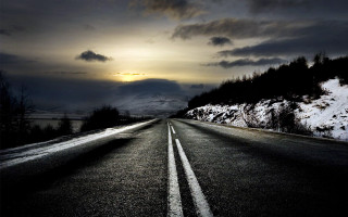 Snowy road hill cloudy sky - a sun setting free wallpaper