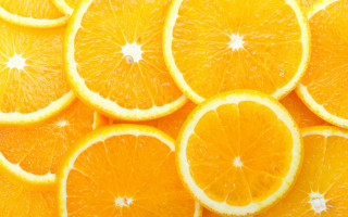 Oranges cut in half stacked - white star free wallpaper