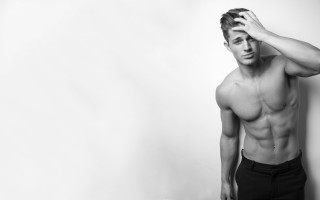 Muscular topless man holding head - his head in his hands free wallpaper