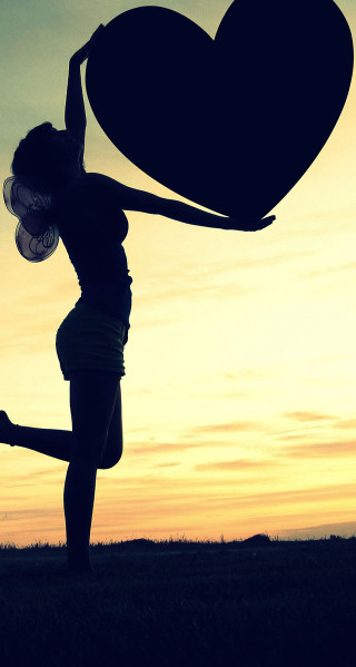 Woman holding heart sunset arms - dawn free wallpaper for mobile