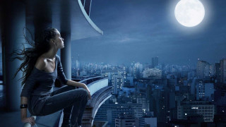 Woman sitting ledged city night - a ledge in front free wallpaper