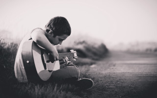 Young man guitar grass hands - a young man free wallpaper