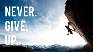 Man climbing mountain never give - a quote above free wallpaper for desktop