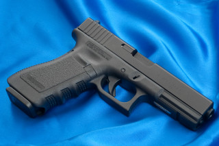 Gun blue cloth black handle 2 - a blue cloth free wallpaper