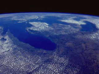 Large crater ocean blue sky - a blue sky background free wallpaper for desktop