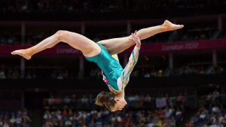 Woman handstand balance beam stadium - a handstand free wallpaper