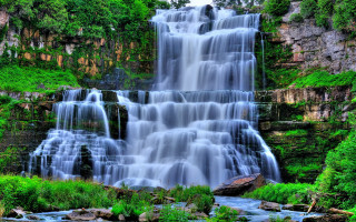 Waterfall cascading lush green forest - a large waterfall free wallpaper