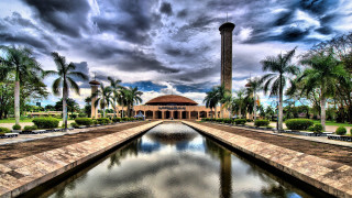 Large building tower pond cloudy - basuki abdullah free wallpaper
