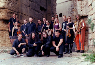 Group people stone wall building - chris rahn free wallpaper