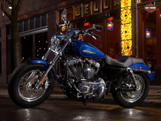 Blue motorcycle parked nighttime lights - the side of the road free wallpaper