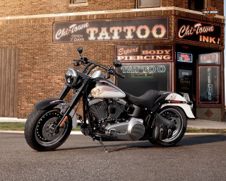 Motorcycle tattoo parlor brick building - a sign free wallpaper