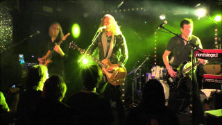 Guitarists performing on stage green - dave allsop free wallpaper