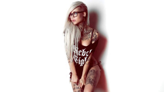 Woman tattoos glasses whitewall gothic - a white wall behind her free wallpaper
