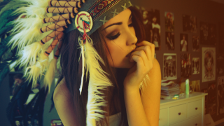 Woman feather headdress posing picture - a picture in a room free wallpaper for desktop