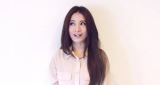 Woman long hair white wall - head and shoulders portrait free wallpaper for desktop